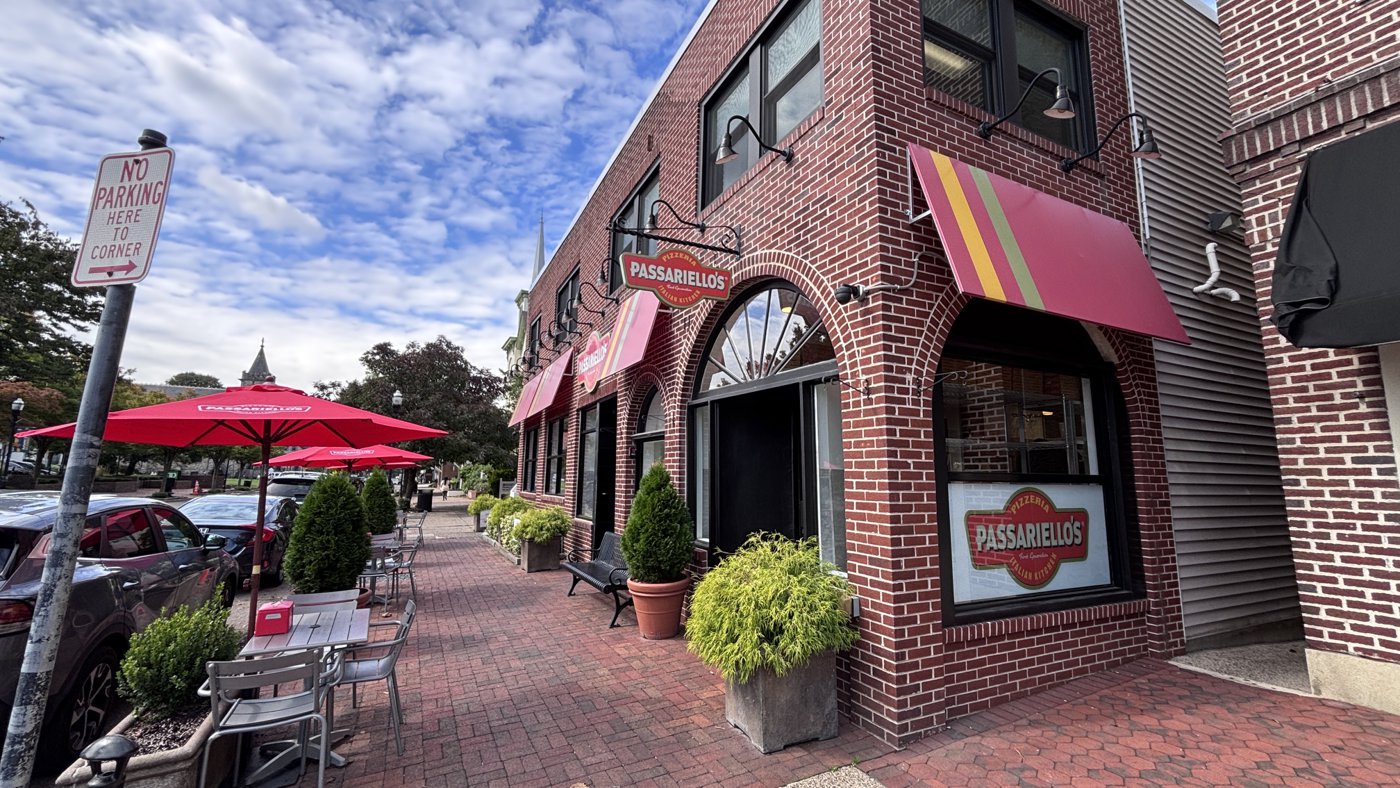 Brick storefronts and outdoor cafe tables along Main Street in Moorestown, NJ