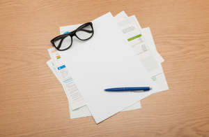 Ocean City condo resale documents, association budget pages, and reserve study paperwork spread out for buyer review