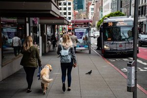 People walking down a busy street