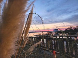 Waterfront dock at sunset on the York River in Gloucester County, Virginia. Gloucester County offers some of Eastern Virginia's most beautiful waterfront living. Photo by local real estate agent Larry McKinney.