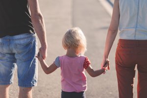 parents and kid walking