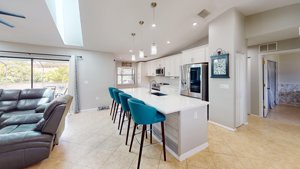 Updated white kitchen with large center island at 2461 Gold Oak Ct E