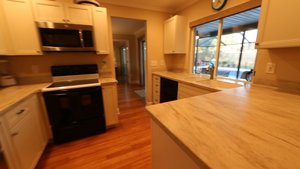 6577 Waterford Circle in Sarasota - New Kitchen overlooking the pool