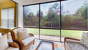 Screened lanai overlooking the nature preserve at 7434 Botanica Parkway