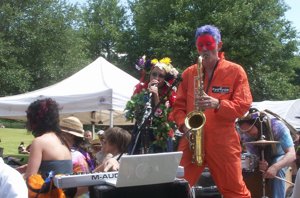 Inman Park Festival masked sax player on a float