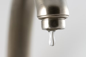 Water dripping image representing waste of water
