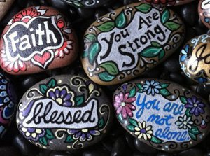 Beautiful painted pebbles with uplifting messages