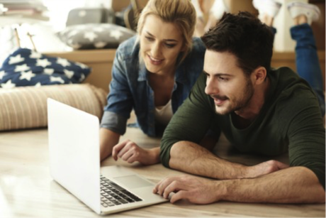 Couple shopping for a home on the internet