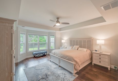 Bluffton home with a show ready primary bedroom