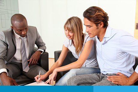 Photo of Couple Meeting with a Loan Officer To Apply For a Home Mortgage