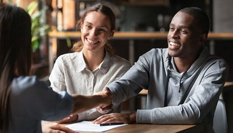 Couple meeting with a Lender For a Home Loan