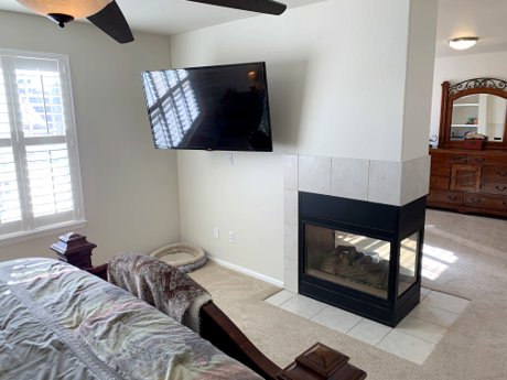 Master Bedroom and Retreat with Three Sided Fireplace 