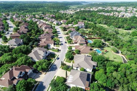 South Austin Texas established neighborhood with single family homes tree lined streets and greenbelt views aerial