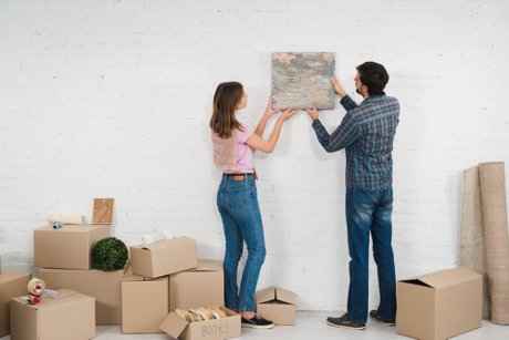 A couple personalizing their new home.