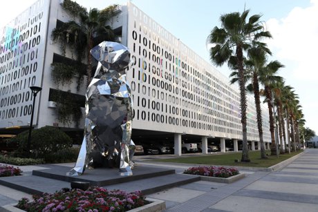 JEFR&Euml; Lake Nona Town Center Sculpture against the Binary Code parking garage 