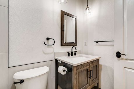 Space conscious rustic modern bathroom remodel with freestanding tub