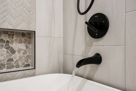 Space conscious rustic modern bathroom remodel with freestanding tub