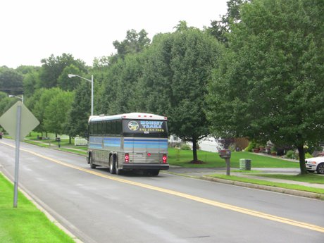 Several Buses Go By Monsey Trails, Coach Bus Versailles at Nanuet Townhouses and Condos in Rockland County NY 10954