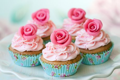 Pink cupcakes with pink flower candy on top