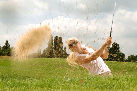 Woman golfing.