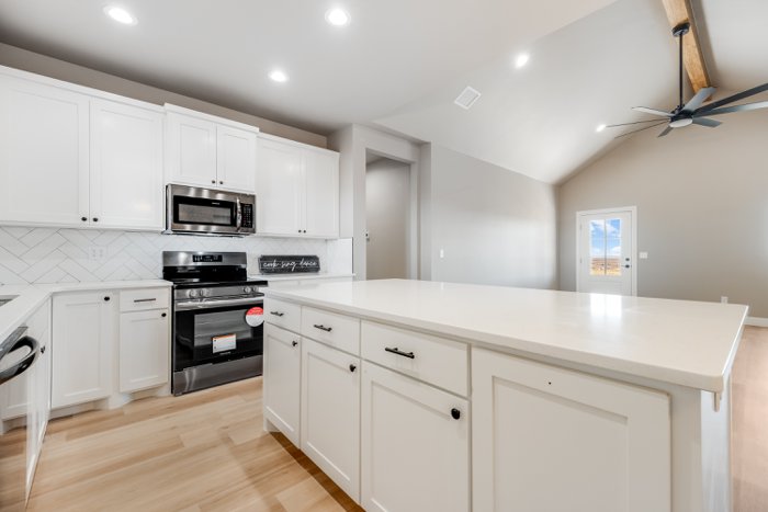 Kitchen with white cabinetry