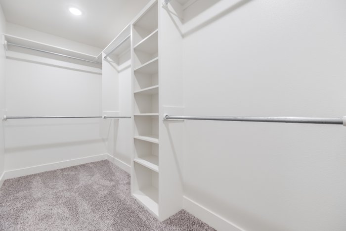 Sample photo: Primary walk-in closet in a completed Deep Canyon home