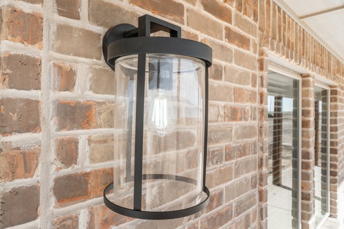 Covered porch with brick and lighting on a Deep Canyon home