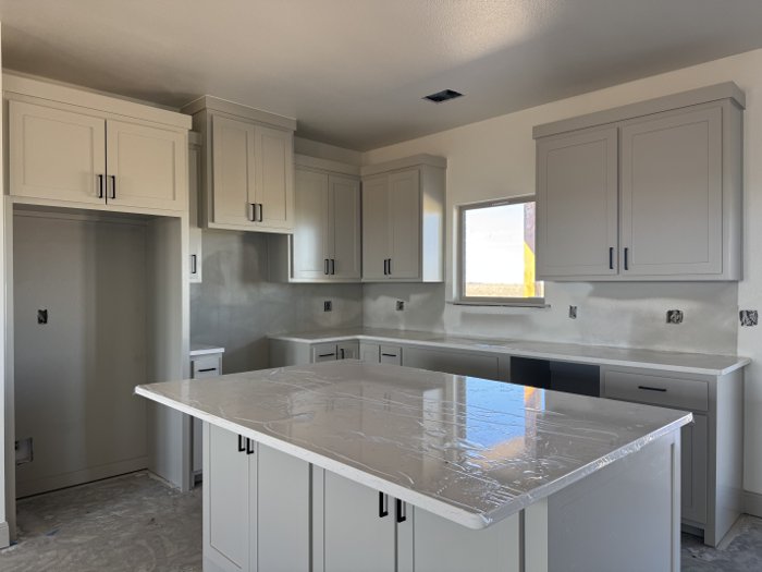 Sample photo: Granite-top kitchen island in the 1,738 sq ft plan