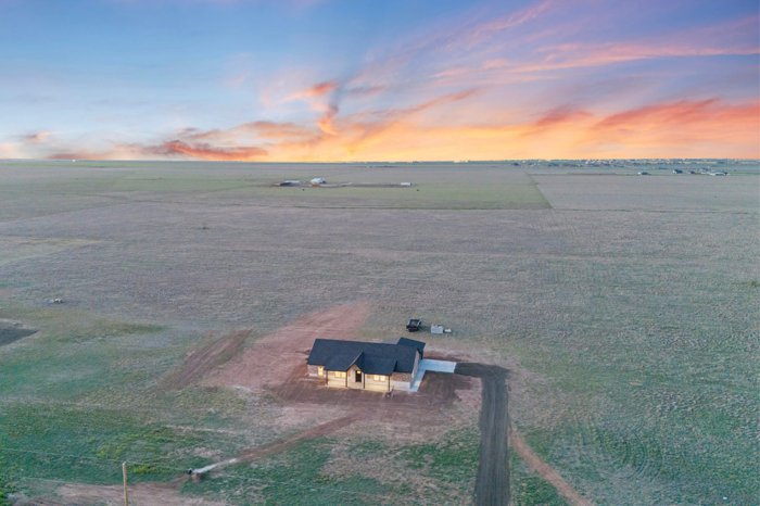 Aerial view of a Deep Canyon home on 10 acres at sunset