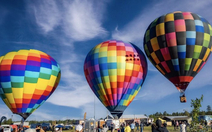 Colorful hot air balloons against a blue sky