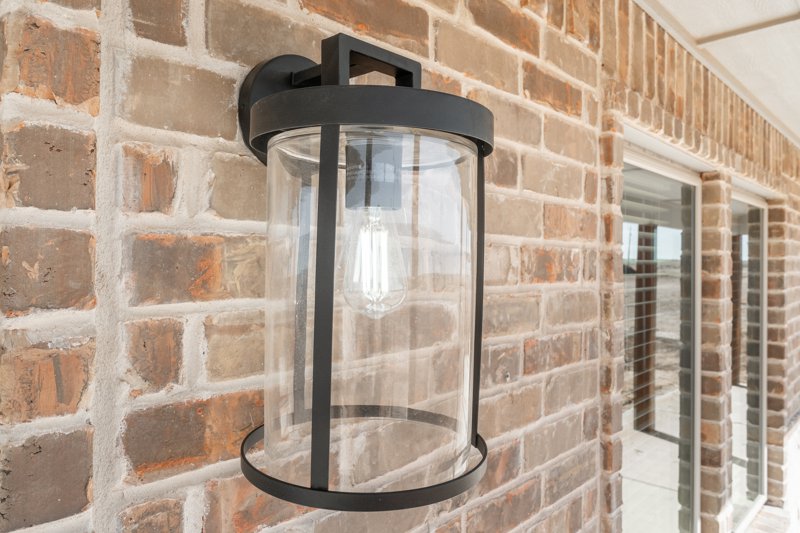 Covered porch with brick and lighting on a Deep Canyon home