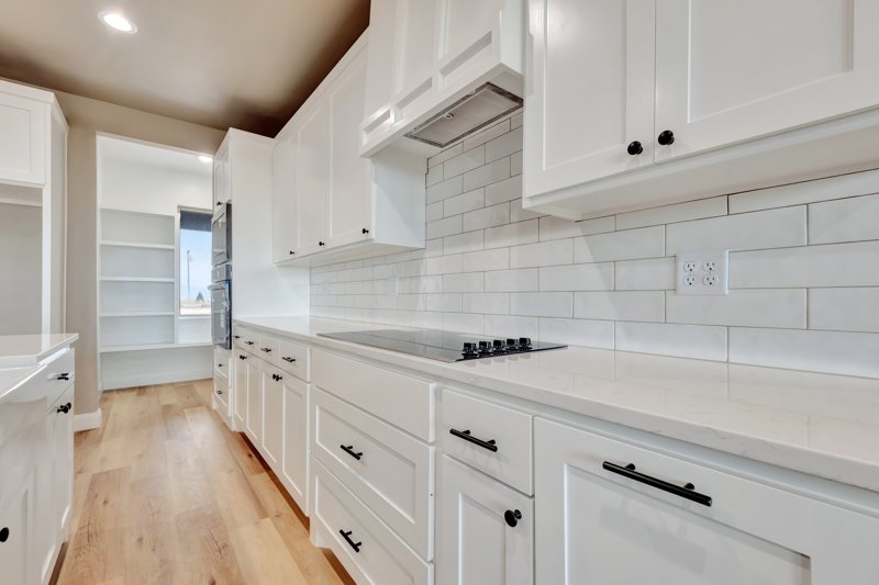 Kitchen cabinetry and finishes by Deep Canyon Homes