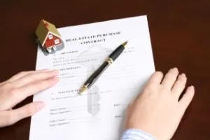 Signing a contract to purchase real estate.
