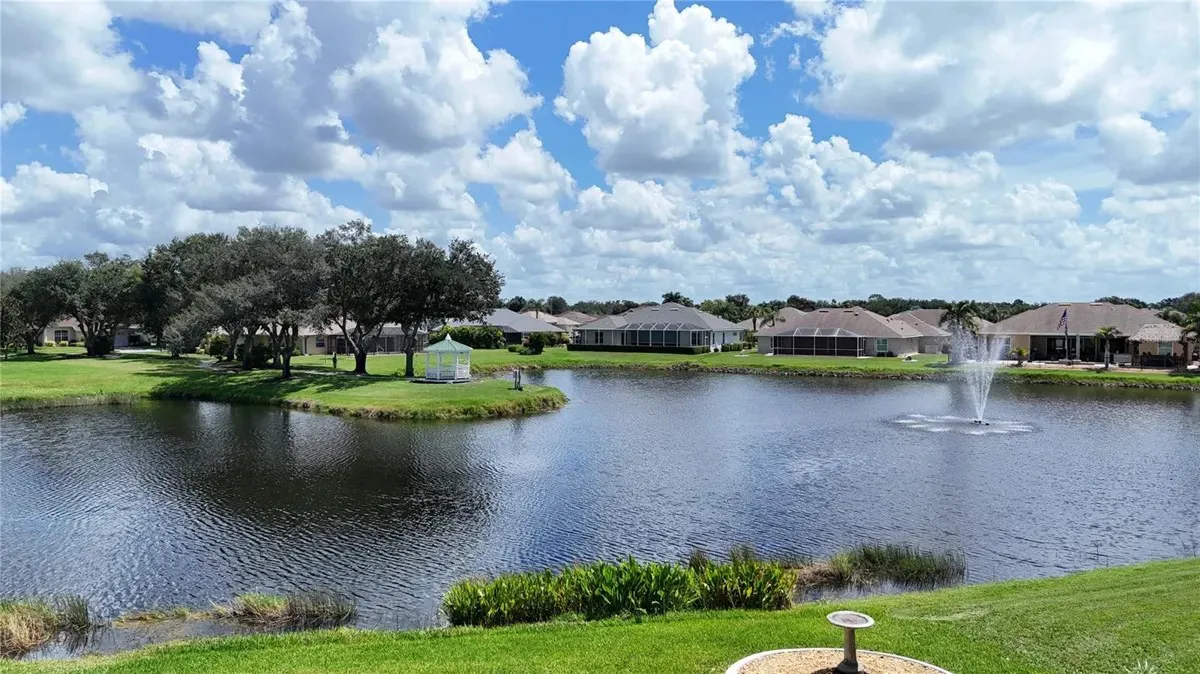 Charleston Park lake and fountain with waterfront homes in North Port Florida