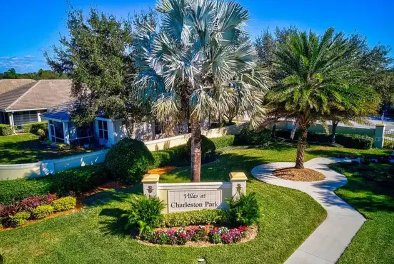 Villas at Charleston Park entrance sign and landscaped grounds in North Port Florida