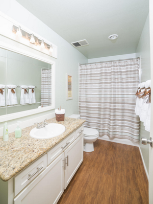 staging your home and staging your bathroom with white linens when preparing your home for sale.