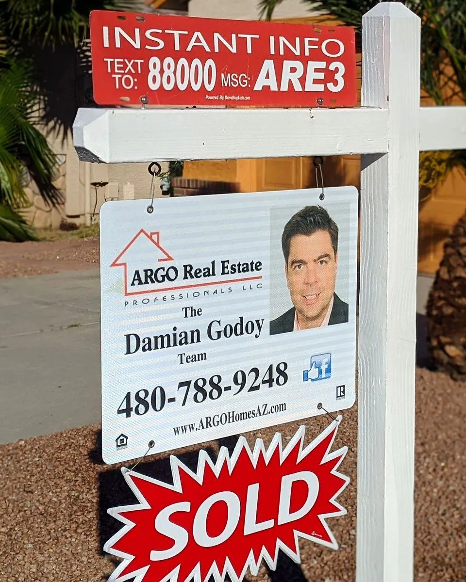ARGO Real Estate yard sign with Damian Godoy and a SOLD rider