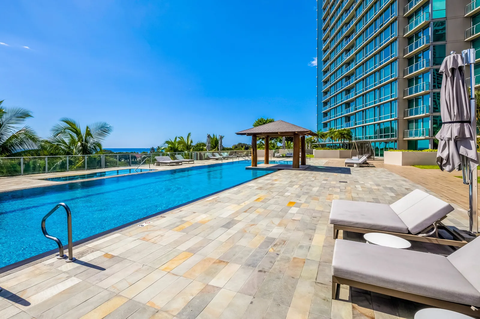 Hokua swimming pool and recreation deck with ocean views