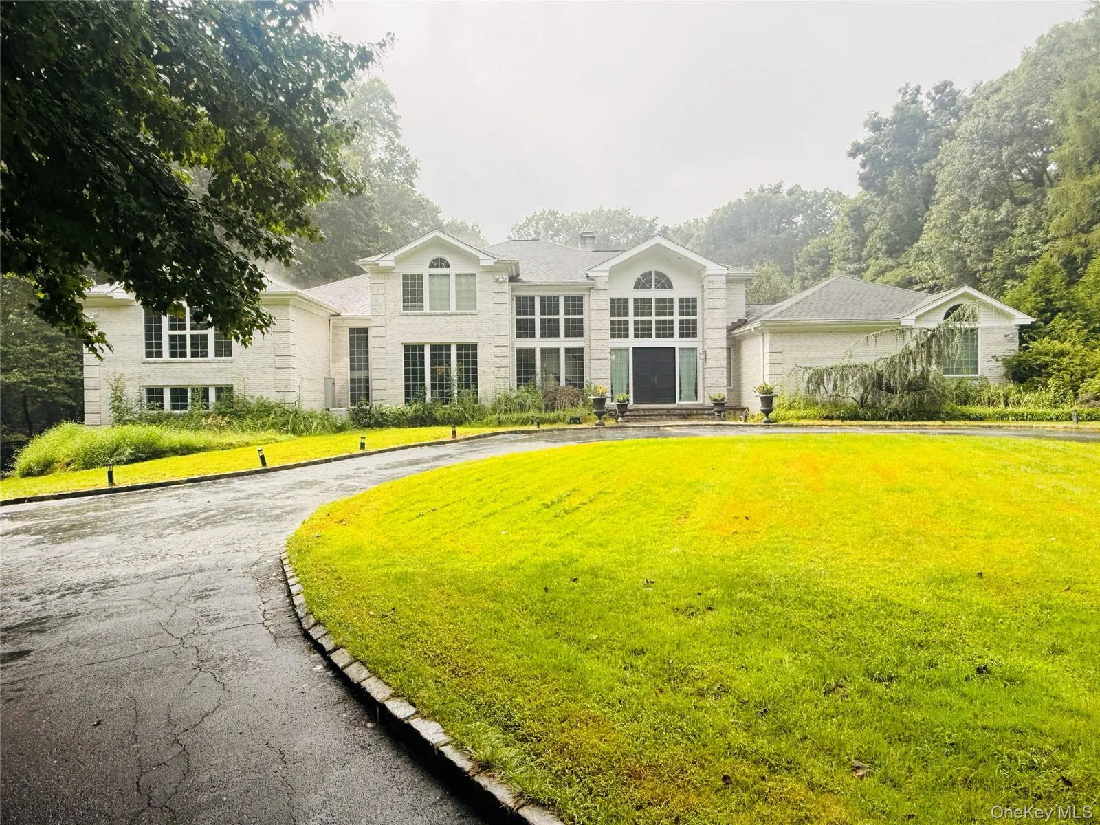 Exterior of 22 Evans Drive in Brookville, with a Glen Head mailing address, New York