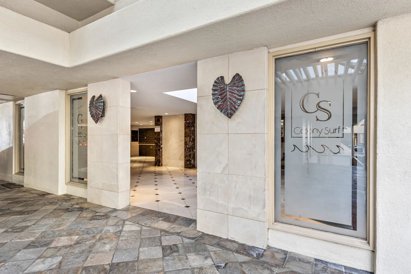 Entrance and lobby at Colony Surf condominium in Honolulu