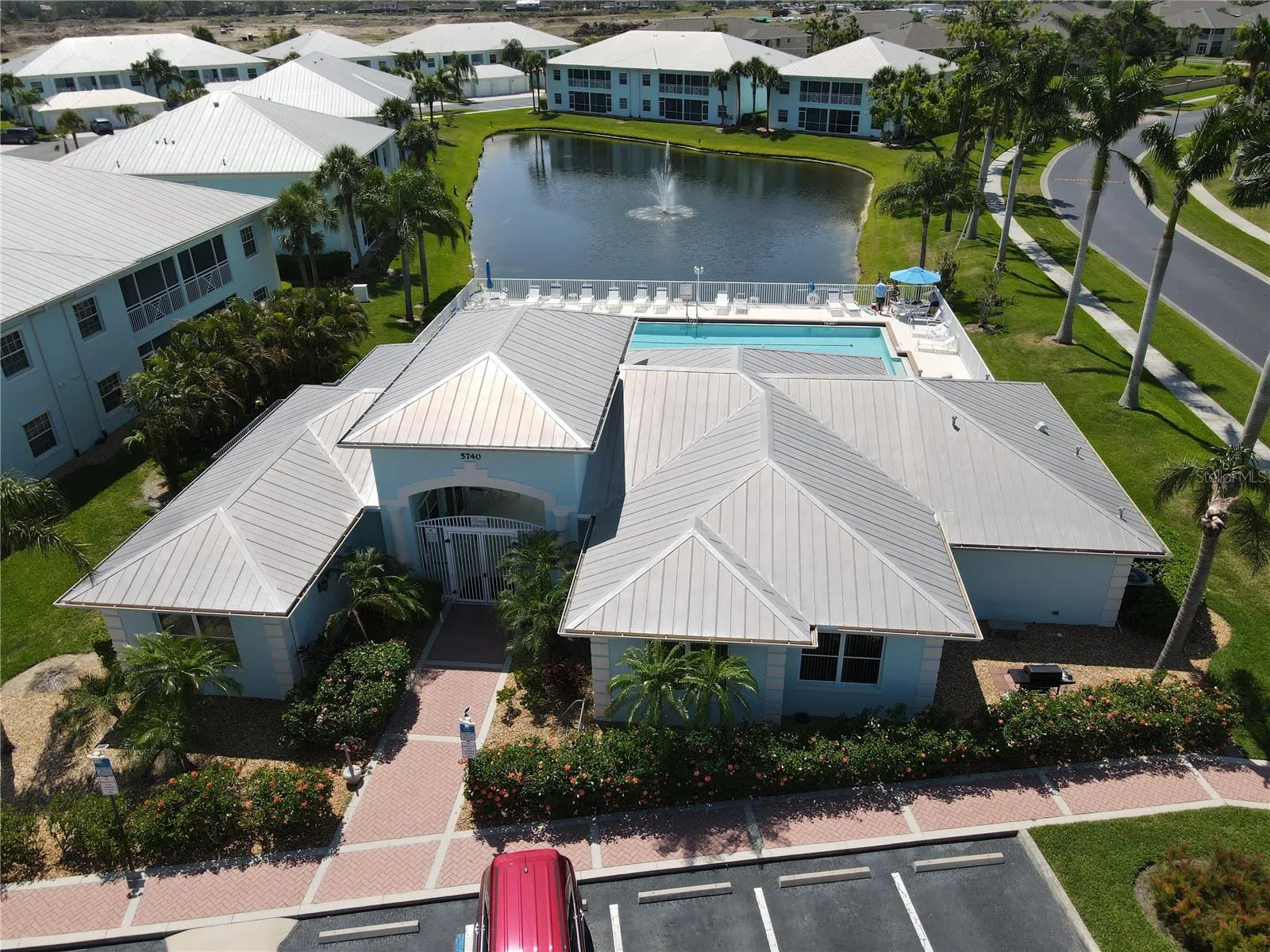 Clubhouse and pool aerial view at The Colony at Sabal Trace North Port Florida