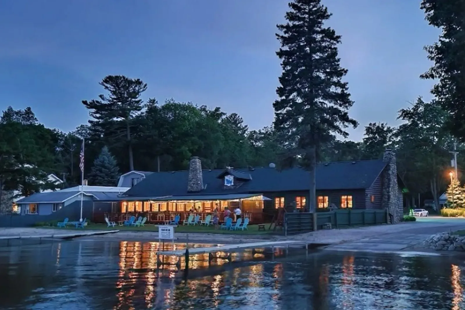 The Douglas Lake Bar and Steakhouse lit up at dusk on the shore of Douglas Lake