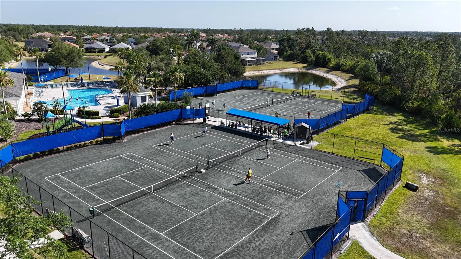 Tennis courts and lake