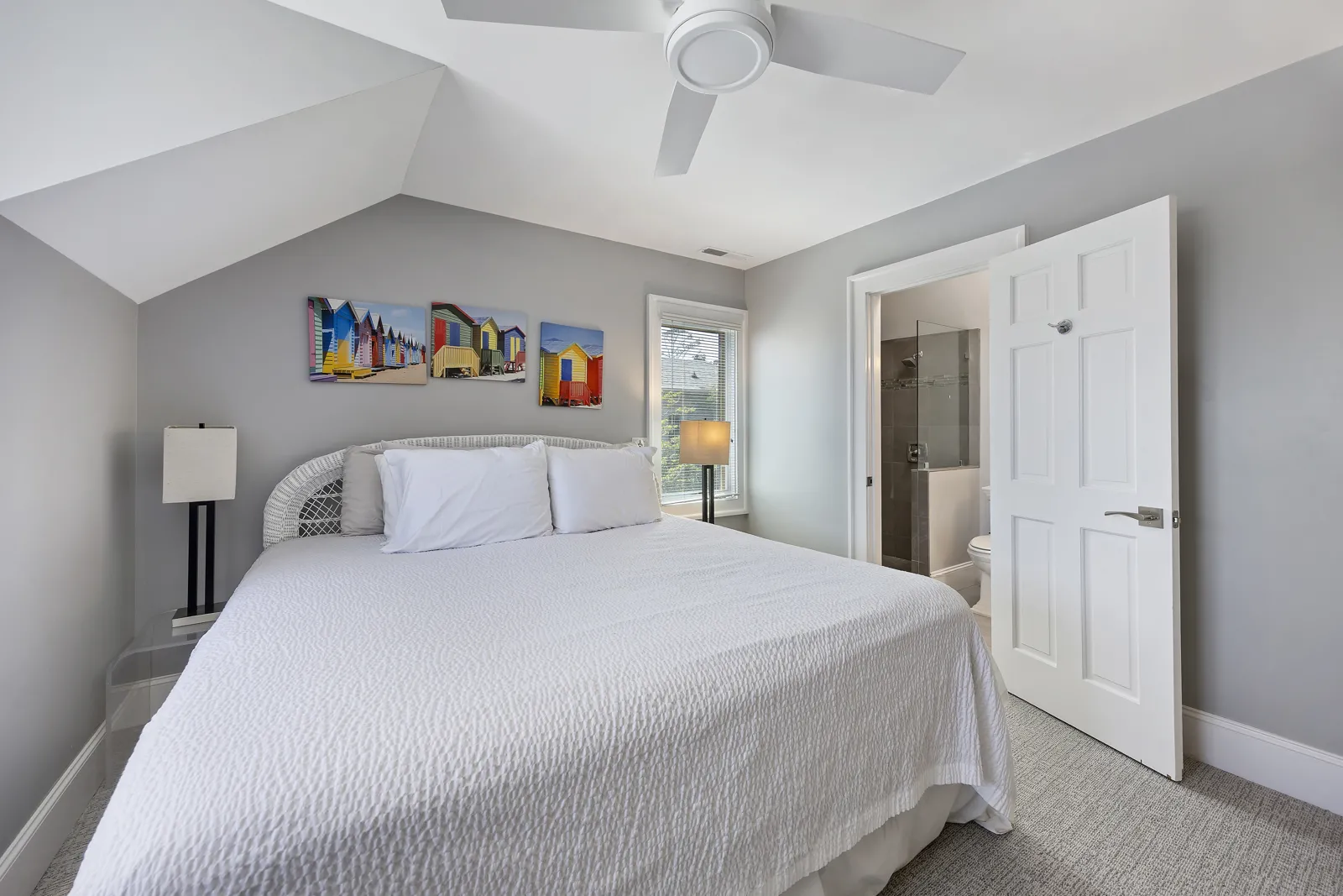Second primary bedroom with king bed and vaulted ceiling