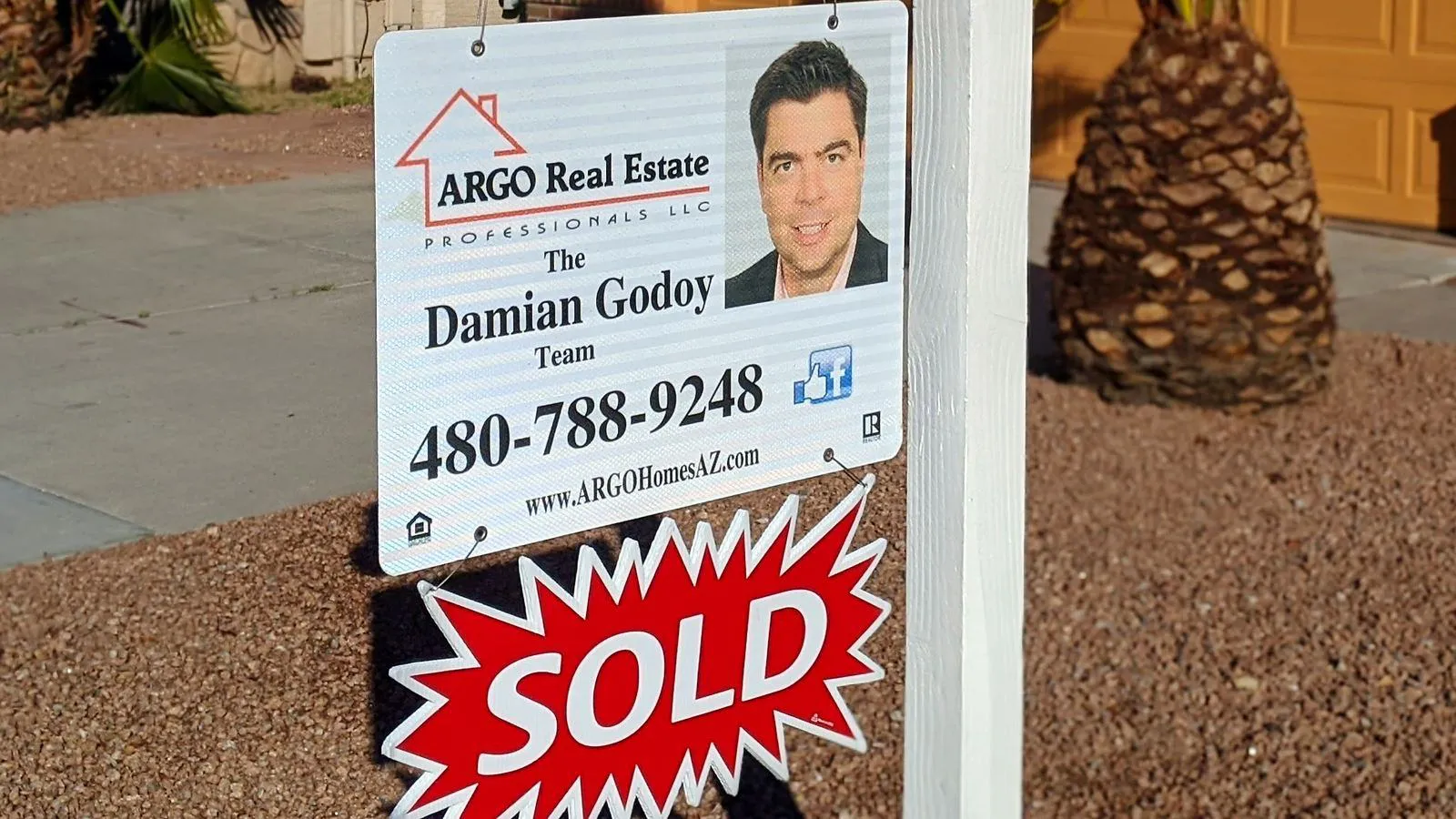 ARGO Real Estate yard sign with Damian Godoy and a SOLD rider