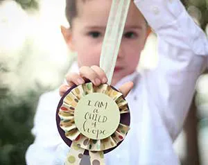 child holding medal