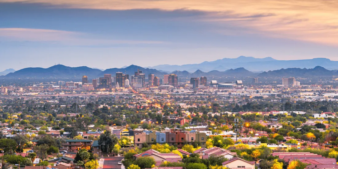 Aerial view of Phoenix Arizona showing city skyline and surrounding neighborhoods across the Valley